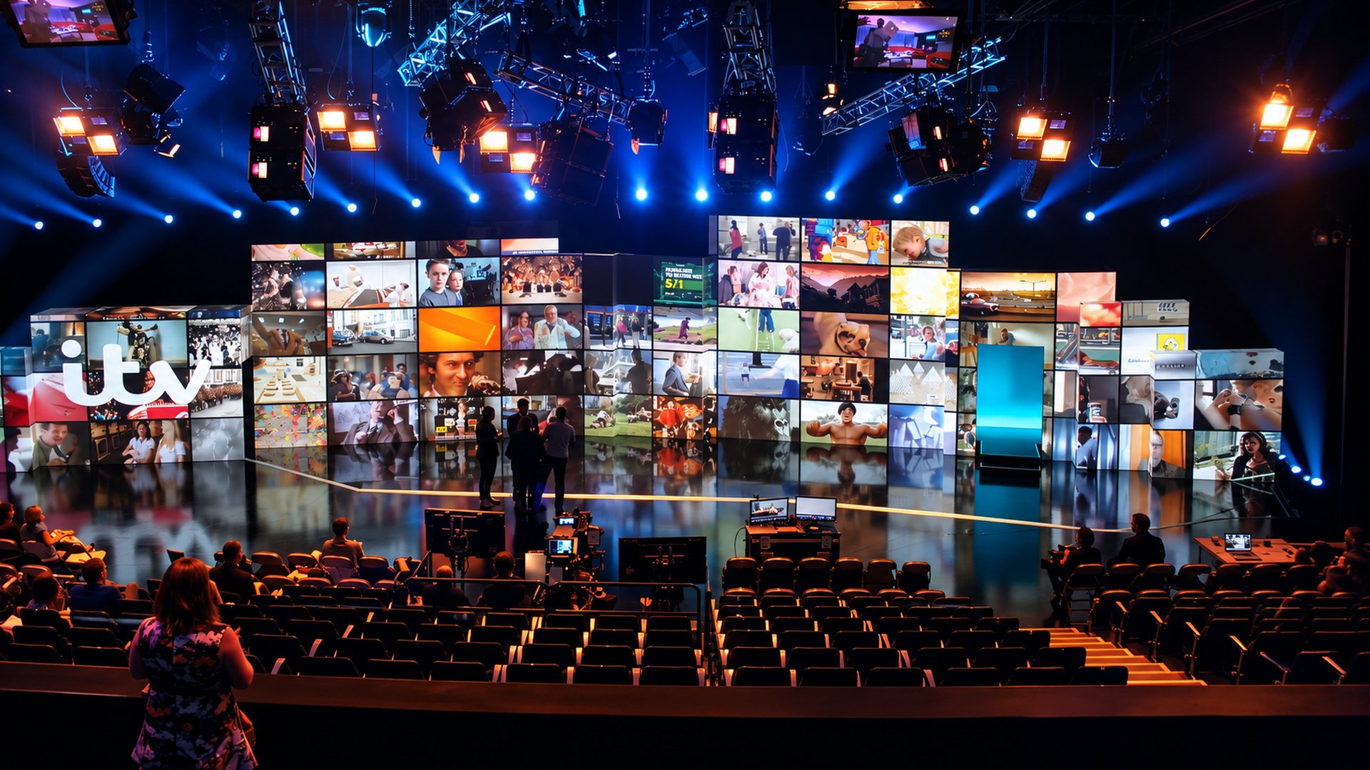 Wide view of the ITV Upfronts stage set, with the video wall and ITV ident, and the audience seated in front.